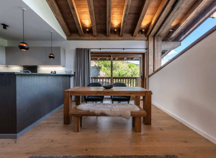 This stunning property boasts a modern kitchen and a cozy dining area, perfect for entertaining.