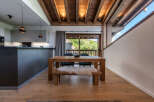 This stunning property boasts a modern kitchen and a cozy dining area, perfect for entertaining.