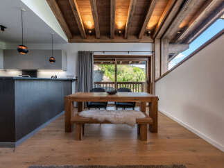 This stunning property boasts a modern kitchen and a cozy dining area, perfect for entertaining.