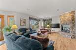 Step into this inviting living room, featuring a cozy fireplace and ample natural light.