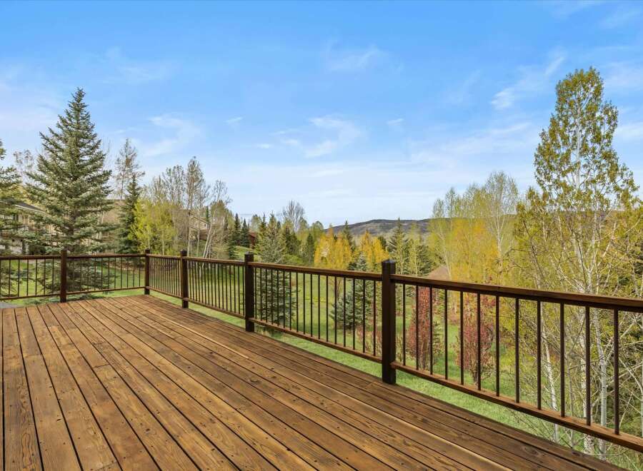 Enjoy breathtaking views from this stunning property! This home features a spacious deck, perfect for relaxing and entertaining.