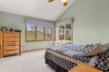 This charming bedroom offers a serene retreat with its rustic wooden furniture and inviting ambiance.