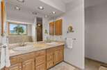 This beautiful bathroom features a double vanity with ample storage, perfect for a shared space.
