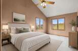 This stunning bedroom boasts a serene ambiance with its neutral color palette and vaulted ceilings.