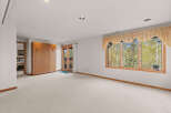 This spacious room offers a bright and airy atmosphere, perfect for relaxation or entertaining.