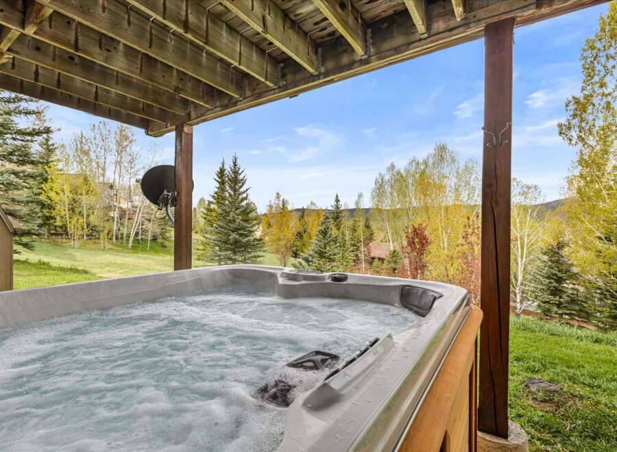 Relax and unwind in this luxurious hot tub, perfectly situated to enjoy stunning views of the surrounding natural beauty.
