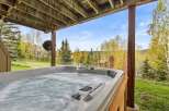 Relax and unwind in this luxurious hot tub, perfectly situated to enjoy stunning views of the surrounding natural beauty.