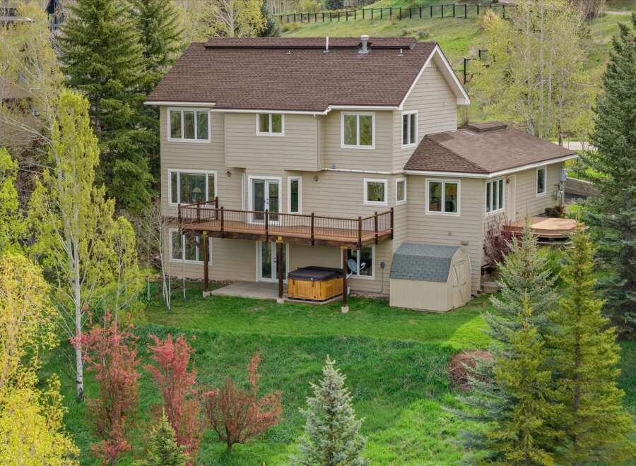 This stunning property boasts a spacious two-story home with a beautiful deck, perfect for enjoying the scenic views.