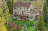 This stunning property boasts a spacious two-story home with a beautiful deck, perfect for enjoying the scenic views.