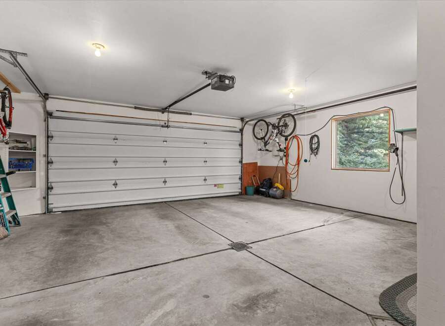 This spacious garage offers ample room for vehicles and storage.