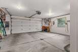 This spacious garage offers ample room for vehicles and storage.