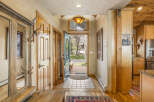 Step into this inviting entryway, showcasing a blend of rustic charm and modern comfort.