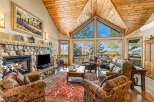 Step into luxury with this stunning living room, featuring a cozy fireplace and a spacious layout.