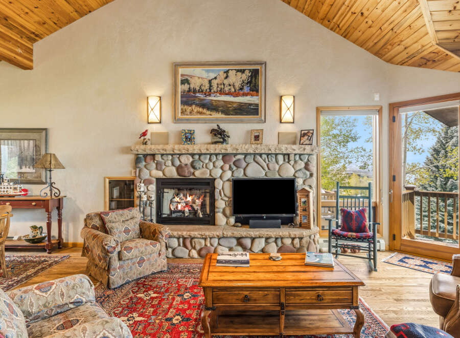 This stunning living room boasts a cozy fireplace, perfect for chilly evenings.