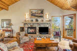 This stunning living room boasts a cozy fireplace, perfect for chilly evenings.