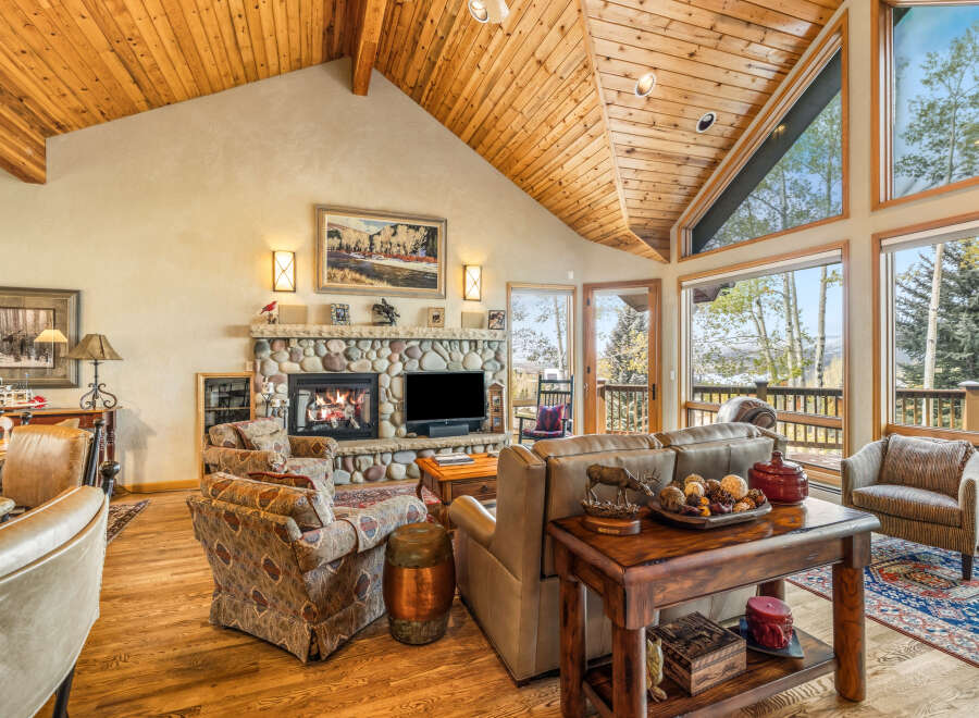 This stunning living room boasts a cozy fireplace, perfect for chilly evenings.