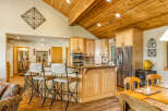 This stunning kitchen boasts a warm and inviting atmosphere, perfect for both everyday living and entertaining.