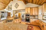 This stunning kitchen boasts a warm and inviting atmosphere, perfect for culinary enthusiasts.