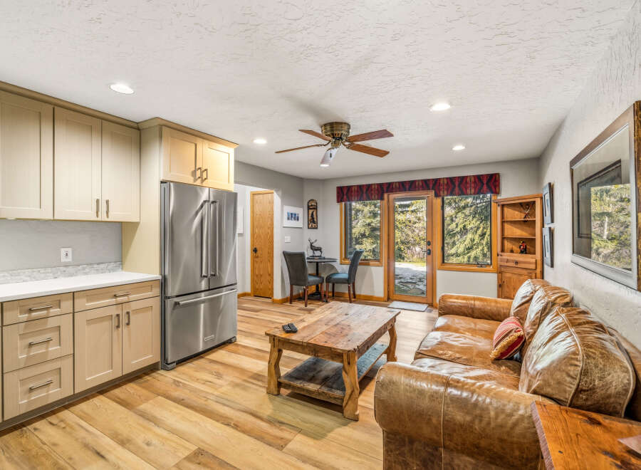 This stunning property boasts a warm and inviting living space, perfect for relaxation and entertaining.