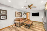 This inviting living space features a cozy leather sofa, perfect for relaxing after a long day.