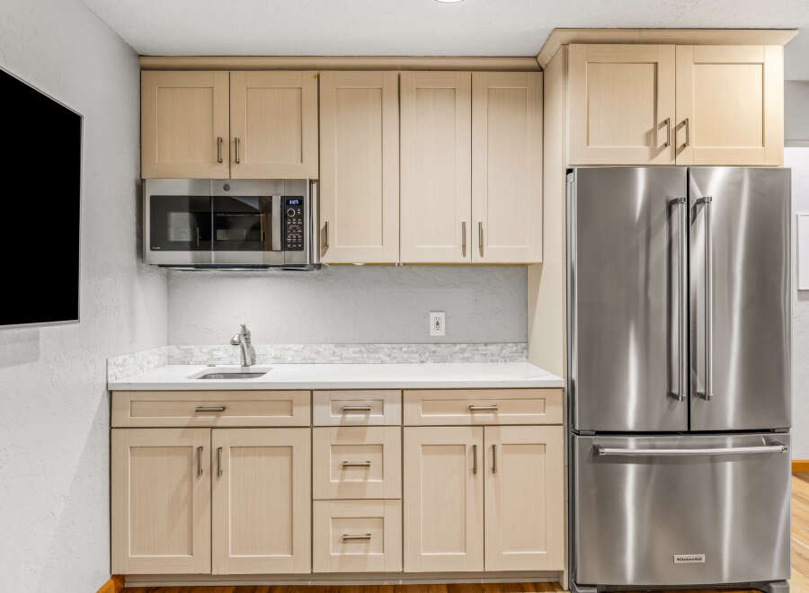 This stunning kitchen boasts modern appliances and ample storage space.