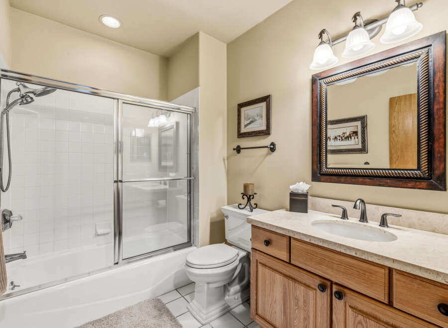This inviting bathroom features a bright and airy design with a clean, modern aesthetic.