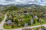 Nestled in a picturesque mountain setting, this stunning property offers a luxurious retreat.