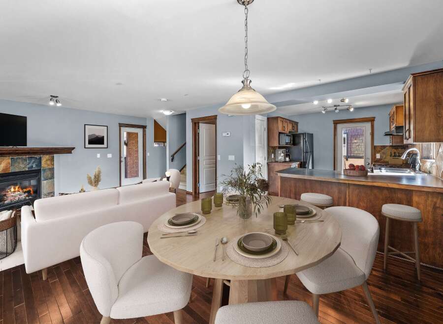 This stunning property boasts a cozy living room with a fireplace, perfect for relaxing evenings.