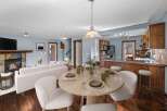 This stunning property boasts a cozy living room with a fireplace, perfect for relaxing evenings.