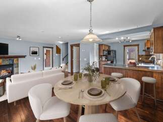 This stunning property boasts a cozy living room with a fireplace, perfect for relaxing evenings.