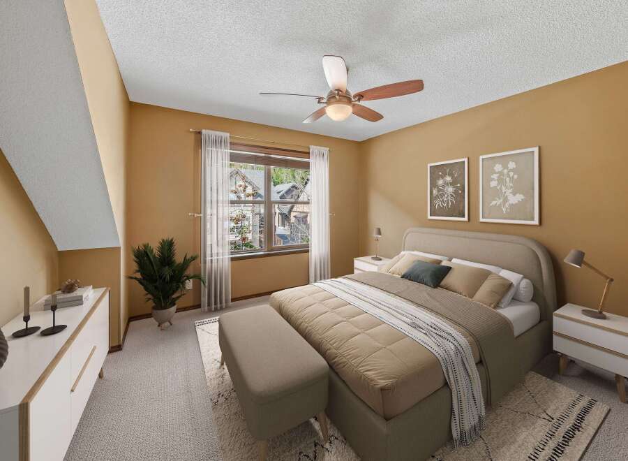 Step into this inviting bedroom, featuring a cozy ambiance and stylish decor.