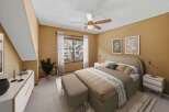 Step into this inviting bedroom, featuring a cozy ambiance and stylish decor.