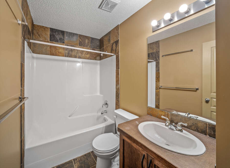 This bathroom features a clean and modern design, perfect for any home.