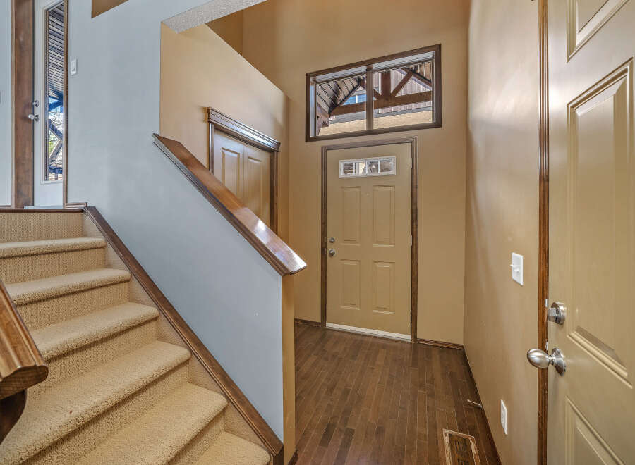 Step into this inviting home and be greeted by a stunning staircase.