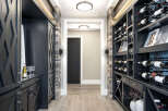 Step into luxury with this stunning wine cellar, a perfect addition to any home.