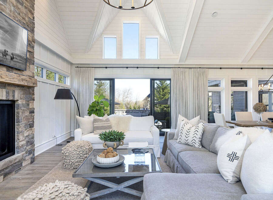 Step into luxury with this stunning living room, boasting a cozy fireplace and elegant design.