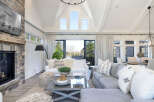 Step into luxury with this stunning living room, boasting a cozy fireplace and elegant design.