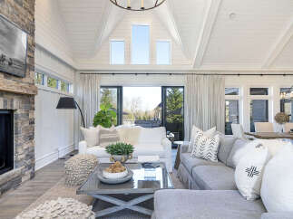 Step into luxury with this stunning living room, boasting a cozy fireplace and elegant design.