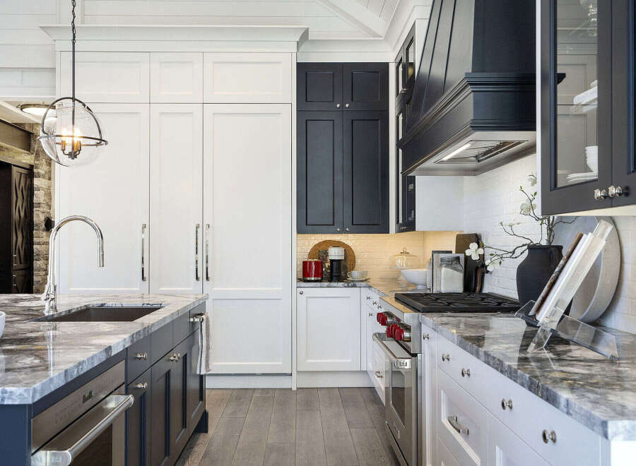 This stunning kitchen boasts a modern design with sleek cabinetry and high-end appliances.