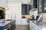 This stunning kitchen boasts a modern design with sleek cabinetry and high-end appliances.