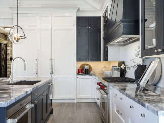 This stunning kitchen boasts a modern design with sleek cabinetry and high-end appliances.