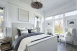 This stunning bedroom offers a serene retreat with its elegant design and ample natural light.