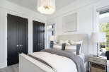 This stunning bedroom boasts a serene and inviting atmosphere, perfect for relaxation.
