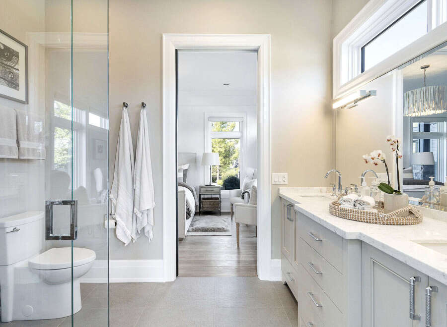 Step into luxury with this stunning bathroom, featuring a sleek design and modern amenities.