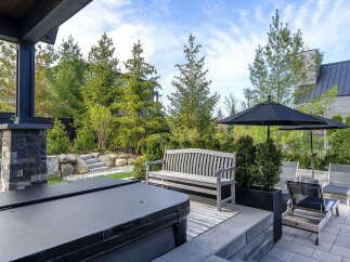 Enjoy outdoor living at its finest with this stunning property, featuring a luxurious hot tub and a beautifully designed patio.