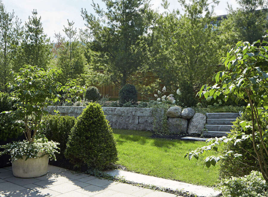 Discover the tranquility of this beautifully landscaped property, perfect for those seeking a serene outdoor space.