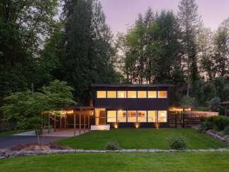This stunning modern home offers a perfect blend of style and tranquility.
