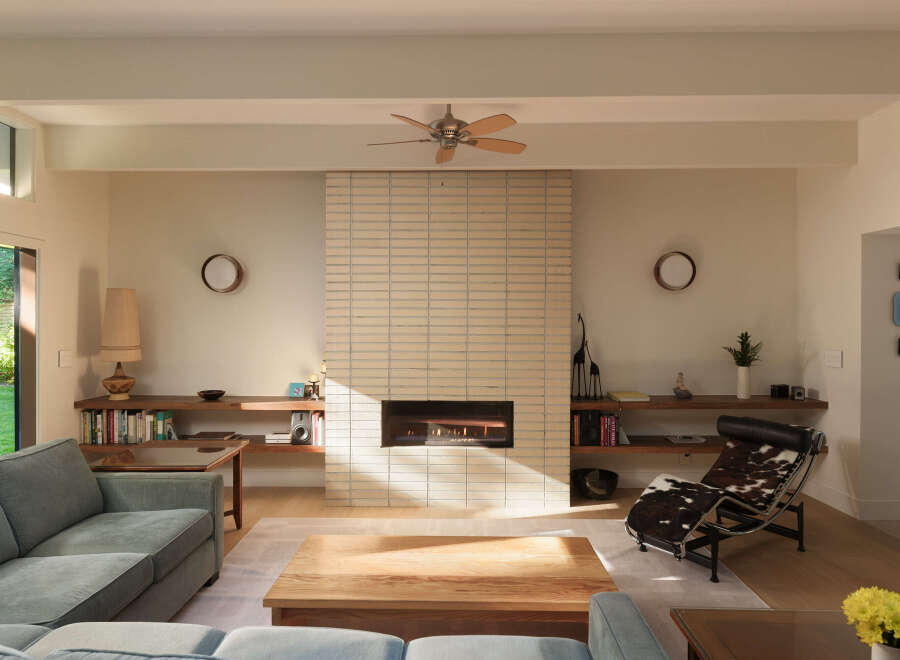 This stunning living room boasts a modern design with a cozy fireplace, perfect for relaxing evenings.