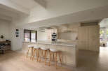 This modern kitchen boasts a sleek design with a large island, perfect for entertaining.