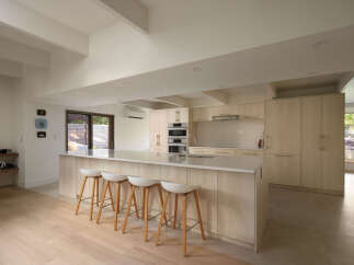 This modern kitchen boasts a sleek design with a large island, perfect for entertaining.